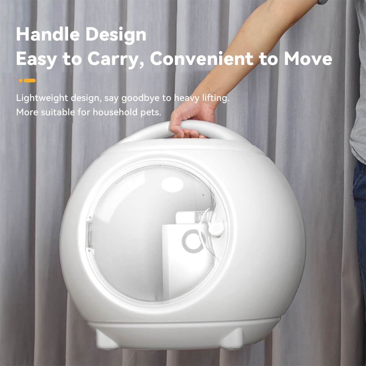 Hand lifting an automatic pet dryer box with handle, showcasing its lightweight and portable design for convenient pet drying at home.