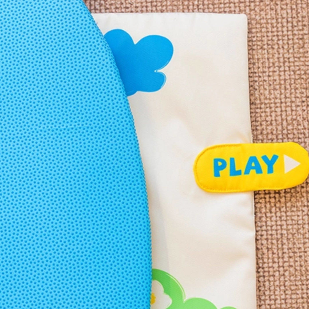 Close-up of squeaky mushroom toy on cat play mat for added stimulation