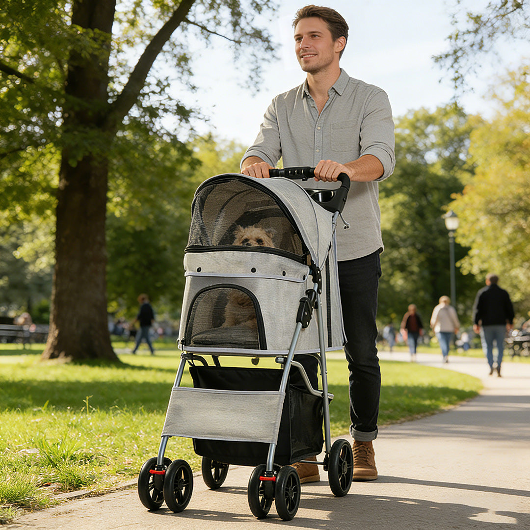Man walking dog in a park using a lightweight foldable pet stroller
